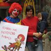 Protesters Call on Ronald McDonald to Retire!